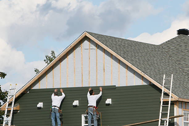 Professional Storm Damage Siding Repair technician working in Harrisburg, NC